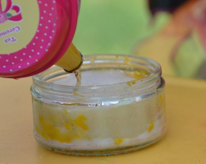 a glass container filled with baking powder and water for a science investigation