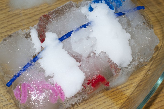 Image of a giant ice cube with salt on the surface to speed up the melting process