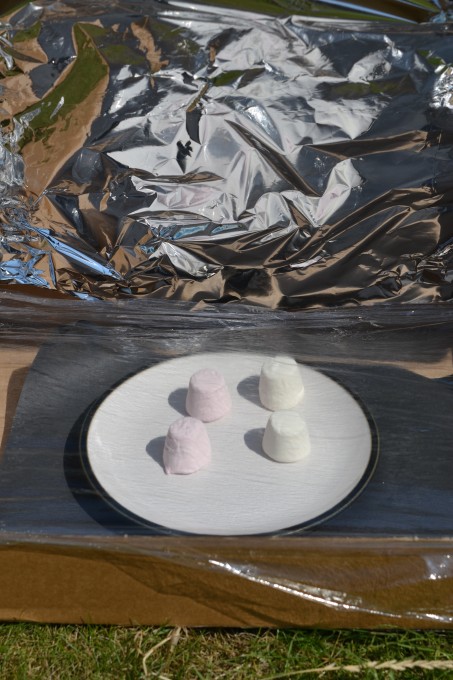 image of a solar oven made with a pizza box, foil and black card
