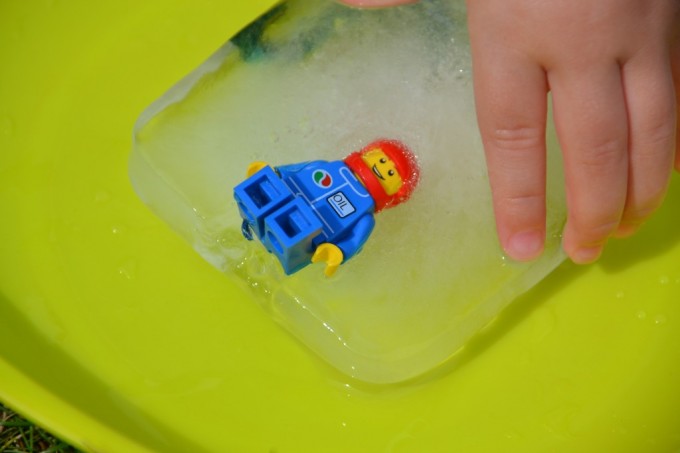 Lego figure in ice on a green plate
