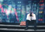 Tired or stressed businessman sitting on the walkway in panic digital stock market financial background