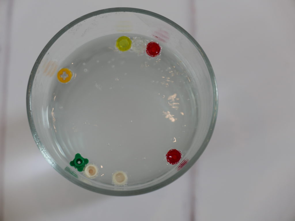 LEGO pieces in a glass of water